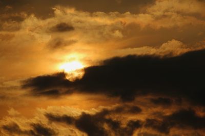 Low angle view of dramatic sky during sunset