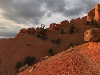 Low angle view of rock formations against sky