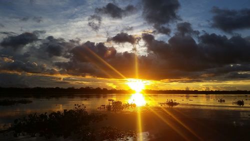 Scenic view of lake against sky during sunset