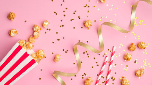 High angle view of pink petals on white background