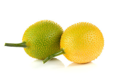 Close-up of fruit against white background