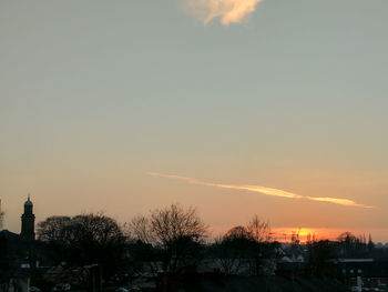 Low angle view of silhouette trees against sky at sunset