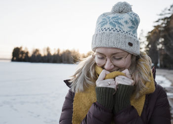 Portrait of a woman wrapped up warm whilst walking in sweden
