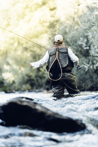 Man fishing in river