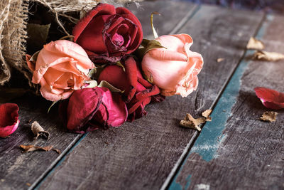 Wilted roses on table