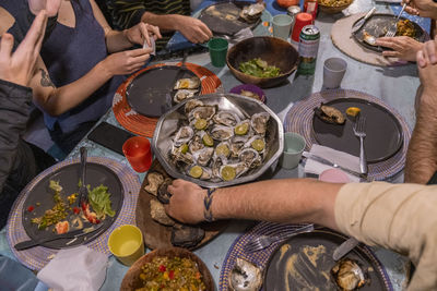 Cropped hand of man preparing food