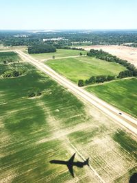 High angle view of field against clear sky