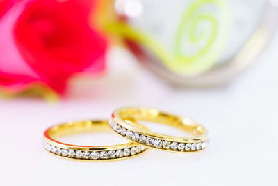 Close-up of wedding rings on table