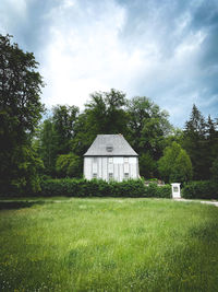 House on field against sky