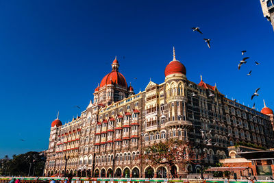 Low angle view of building against blue sky