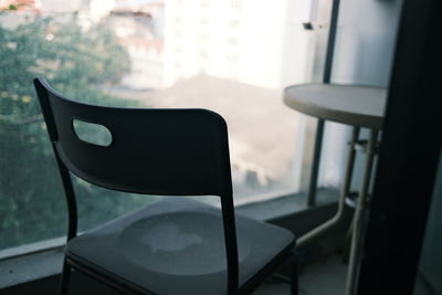 Close-up of empty chair on table