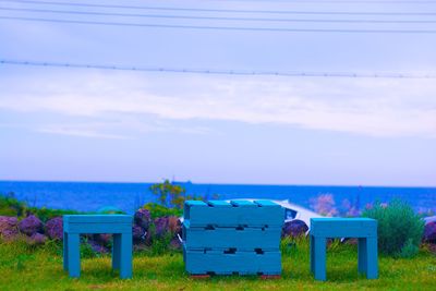 Lifeguard hut on beach against sky