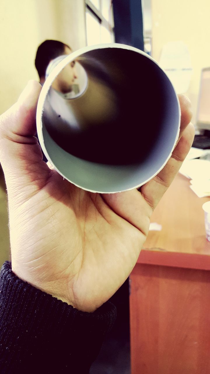 person, indoors, holding, part of, cropped, coffee cup, food and drink, close-up, drink, human finger, table, unrecognizable person, coffee - drink, refreshment, focus on foreground, coffee, cup