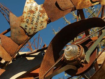 Close-up of rusty wood against sky