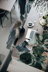 High angle view of woman working on table