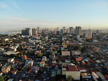 High angle view of modern buildings in city against sky