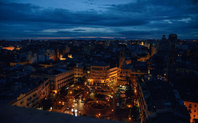 High angle view of illuminated buildings in city at night