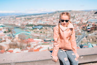 Full length of young woman in sunglasses