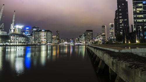 Illuminated city at waterfront