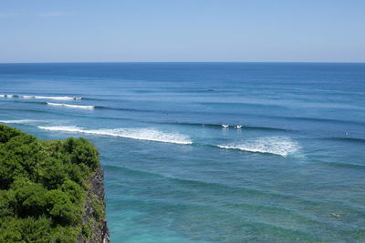 Scenic view of sea against blue sky