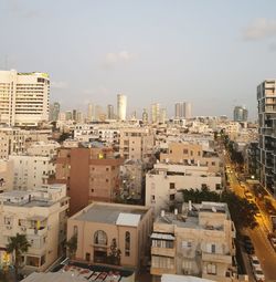 High angle view of buildings in city against sky