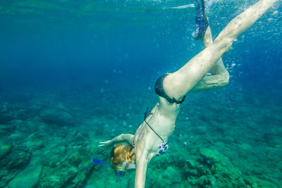 Woman swimming in sea