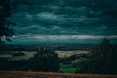 Scenic view of landscape against cloudy sky