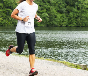 Full length of woman running on lake