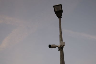 Low angle view of street light against sky