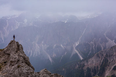 Man standing on top of dolomites