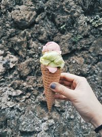 Close-up of hand holding ice cream