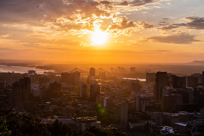 Cityscape against sky during sunset