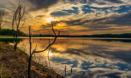 Scenic view of lake against orange sky