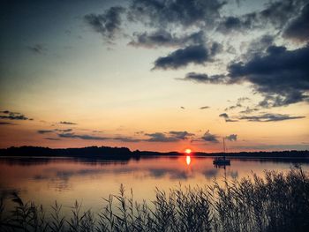 Scenic view of lake against sky during sunset