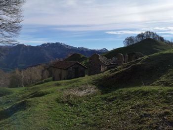 Scenic view of landscape and mountains against sky