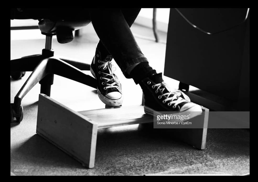 LOW SECTION OF MAN STANDING AT TABLE