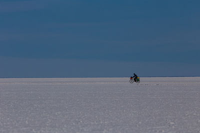 Man riding motorcycle on desert