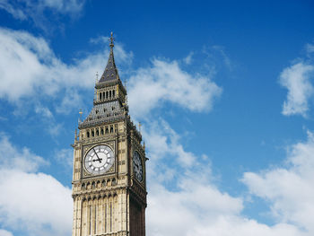 Low angle view of clock tower against sky