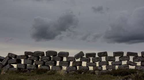 View of cemetery against cloudy sky