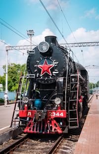 Train on railroad track against sky