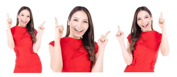 Portrait of a smiling young woman against white background