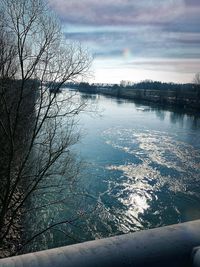 Scenic view of lake against sky during winter