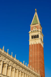 Low angle view of historical building against blue sky