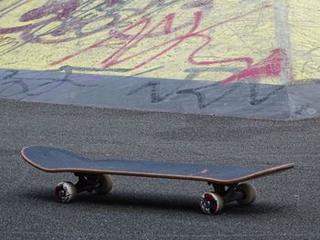 High angle view of skateboard on road