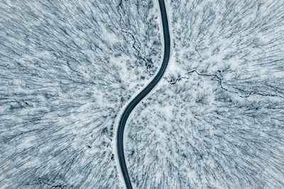 High angle view of snow on sea against sky