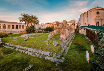 Temple of apollo in the centre of ortigia, syracuse at sunset