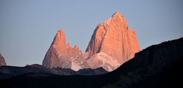 Panoramic view of mountain range against clear sky