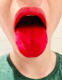 Close-up of woman with red face
