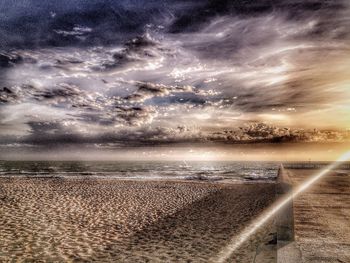 Scenic view of sea against cloudy sky