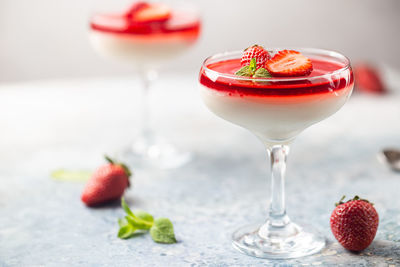Close-up of strawberries in glass on table